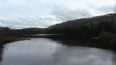 Vast River with Forested Hills Stock Footage 32422049