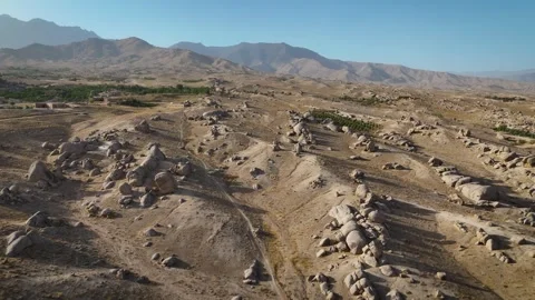 Vast Rocky Landscape with Dramatic Mountain Ranges Stock Footage 320098556