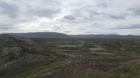 A vast, rolling green volcanic landscape in Iceland under an overcast sky. Stock Footage 335961874