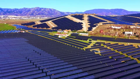 Vast solar farm installation on a hillside landscape Video stock 333836409