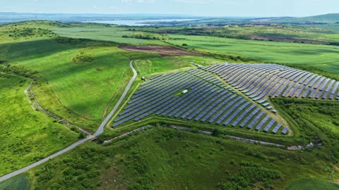 Vast solar landscape. Panoramic drone shot of countryside solar panel array. Video stock 337910513