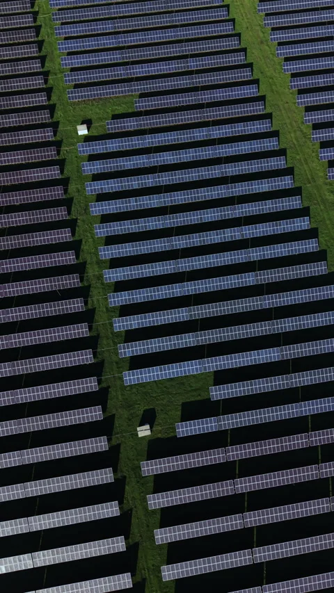 Vast solar panel array capturing sunlight to provide renewable energy in a sunny Stock Footage 332040646