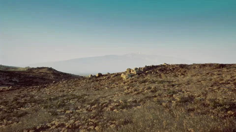 Vast uneven landscape with high mountain summits and open air space Stock Footage 341566528