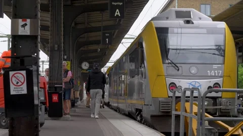 Västtrafik commuter train at Göteborg Central Station with passengers boarding Stock Footage 312380604