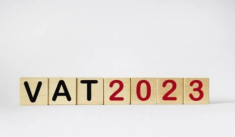VAT in the concept of 2023. Value Added Tax. Text VAT and 2023 on wooden cu.. 스톡 사진