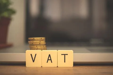 VAT increase concept. Value added tax on wooden block cubes. Business desktop Stock Photos