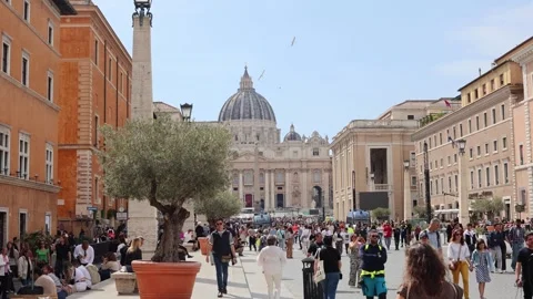 Vatican - April, 23, 2025: Crowd walks toward St. Peters Basilica in Vatican Stock Footage 307645370