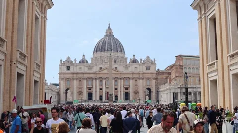 Vatican - April, 23, 2025: Massive crowd gathers in front of St. Peters Basilica Stock Footage 307646016