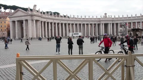 The vatican courtyard inside it with cyclists bicyclists pan from left to right Stock Footage 252147994