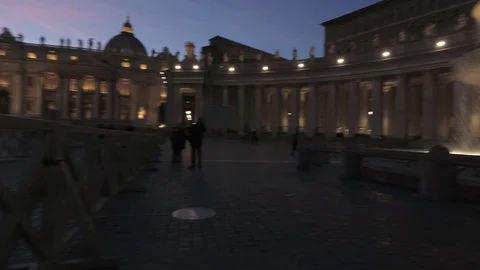 Vatican - Saint Peter square Pan view with the fountain and the dome at dusk Stock Footage 99359437