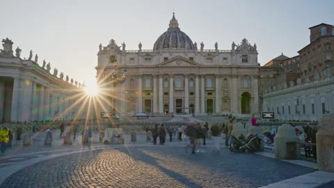 Vatican at St Peter square at sunset. The sun sets behind St Peter's cathedral Stock Footage 309020257
