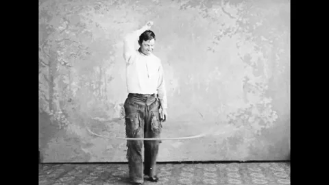 Vaudeville Performer Demonstrates Lasso Techniques On Stage Stock Footage 132286515