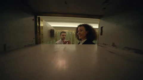 Vault Security Couple using a safety deposit box for private financial Stock Footage 278696879