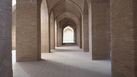 Vaulted arch passageway among columns at Jameh Mosque of Isfahan Video stock 99967782