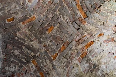 The vaulted ceiling of an ancient temple made of red brick Stock Photos
