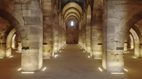 Vaulted stone hall with monumental arches, columns - Stone Vault and Column Hall Stock Footage 340525022