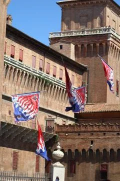 Vaulting of flags with the background of a medieval castle Foto stock