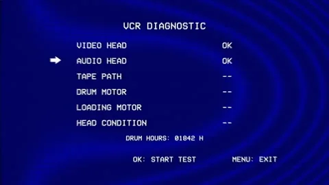 VCR diagnostic menu displays audio head, tape path, drum motor and loading test Stock Footage 345699296