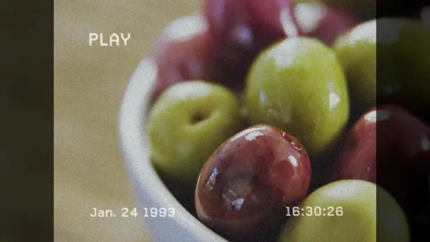 VCR PLAY timestamp overlay starting ceramic bowl with olives flickering and 스톡 동영상 314454719