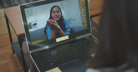 VDO conference on sofa as working at home during corona virus or Covid 19 Stock Footage 135659838