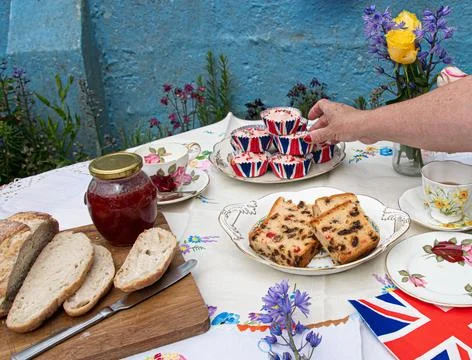 VE Day 80th style afternoon tea party set in a garden Stock Photos