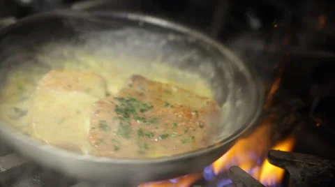 Veal Cutlets Cooking in Pan with flames Stockbeeldmateriaal 42702048