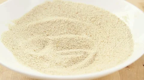 Veal escalope being turned in breadcrumbs Stock Footage 24652067