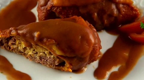 Veal roll filled with chicken, cheese and sauce, loop Stock Footage 61708780