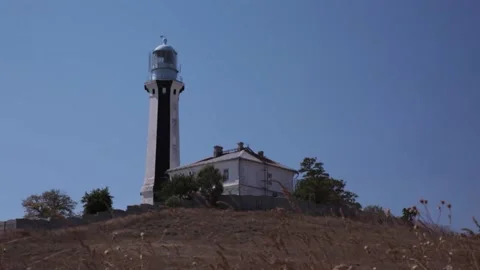 Вeautiful Black And White Lighthouse. Windy Sunny Day Stock Footage 170601403