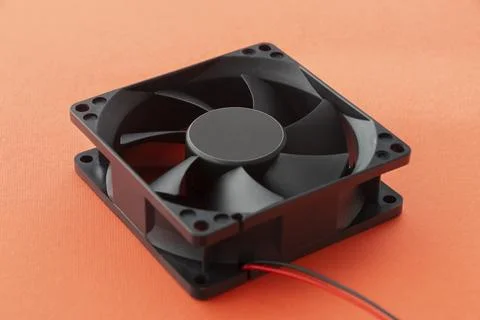 Vector computer fan 12 volt, on orange background Stock Photos