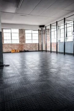 Vector flat design showing empty CrossFit gym with rubber flooring, pull up rig, Stock Photos