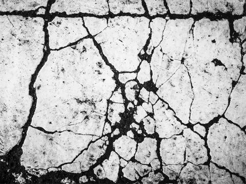 Vector grunge texture of cracked paint on asphalt Illustrazione stock