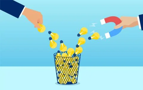 Vector of a hand with magnet attracting creative ideas form waste basket Stock Illustration