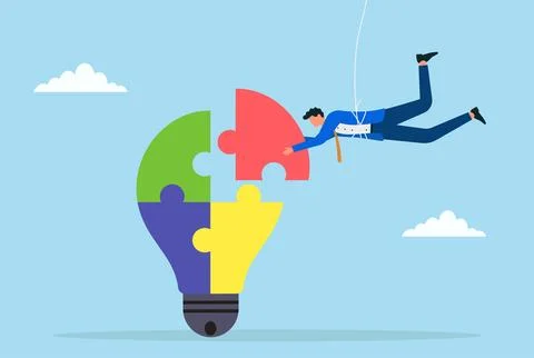 Vector illustration of a businessman placing the final puzzle piece into a bulb Stock Illustration