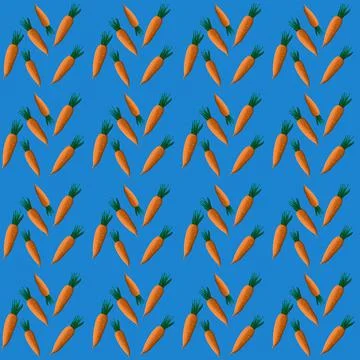 Vector seamless pattern with cute orange carrots on blue background Stock Illustration