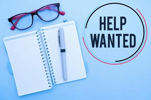 Vector of sign 'Help Wanted' in circle near glasses and notebook with pen in blu Stock Photos
