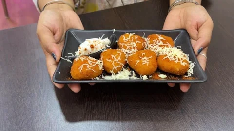 Veg corn cheese balls served with mayonnaise in a black plate. Stock Footage 308100775