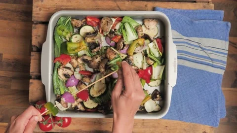Vegan Barb flat lay: hands putting cut vegetables prepared for vegetable skewers Stock Footage 199610741