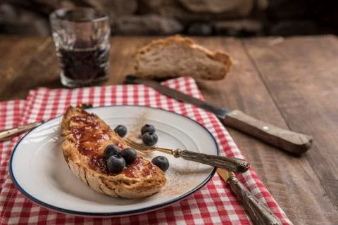 Vegan brunch, toasted rustic bread with peanut butter and strawberry jam Stock Photos
