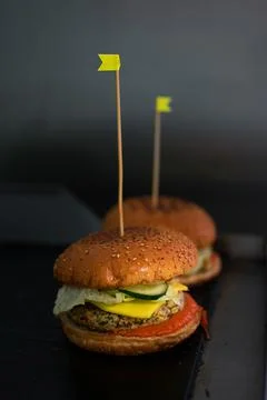 Vegan burger on dark background in kitchen with copyspace Stock Photos