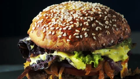 Vegan burger revolves on a slate plate. Stock Footage 197548762