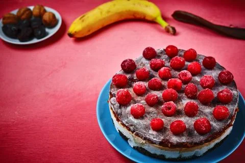 Vegan cake with coconut layer, dates and cherries Stock Photos