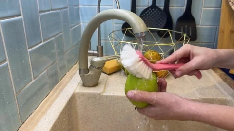 A vegan child practices kitchen hygiene Video stock 331567677