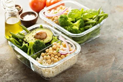 Vegan meal prep containers with cooked rice and chickpeas Stock Photos