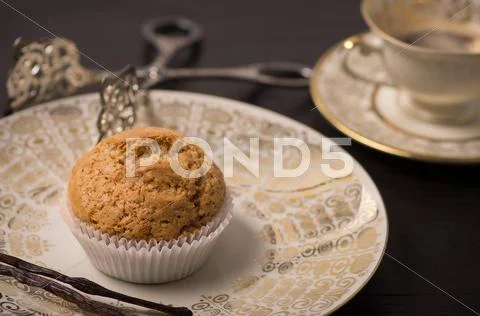 Vegan muffin on antique plate. Stock Photos