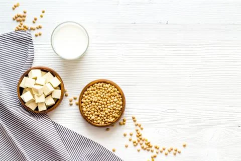 Vegan soy milk with soy beans on white background top-down copy space Stock Photos