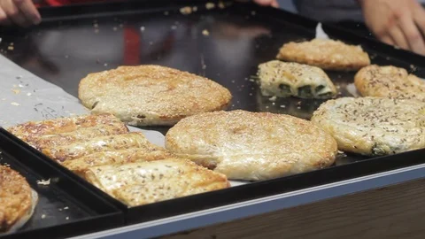 Vegan, vegeterian pies sell on street market, Tasty, delicious bakery, tareaway Stock Footage 91935495