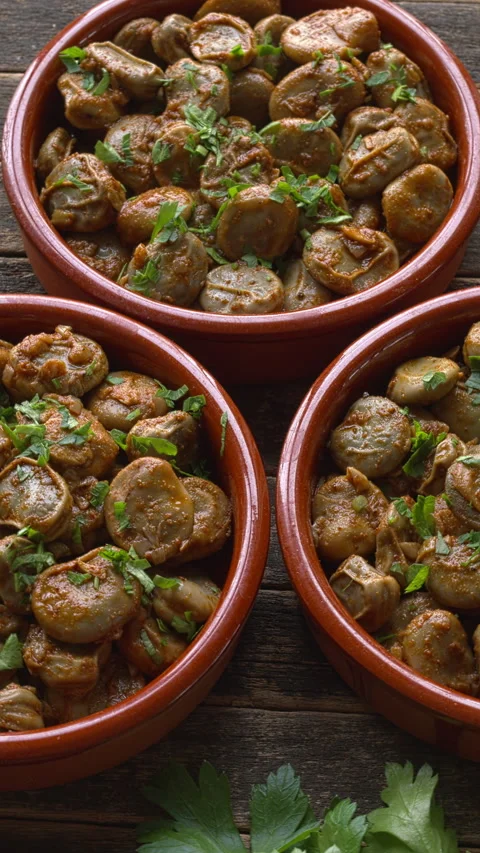 A vegan version of Spanish broad beans - habas con jamón. Vertical video. Stock Footage 318829234