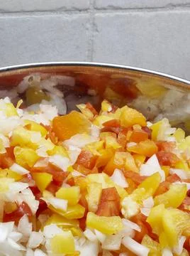 A vegatable close-up with copy space of fresh salsa including red pepper, yel Stock Photos