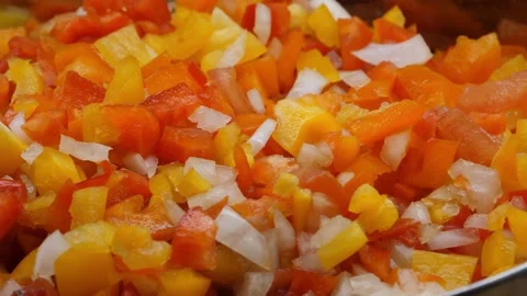 A vegatable close-up of fresh salsa with ingredients being added including re Video stock 156751856